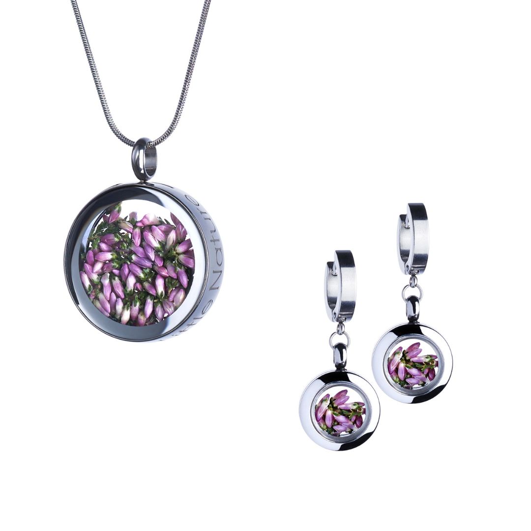 Heather Flowers Jewelry Gift Set with dangle huggie earrings and a magnified nature necklace in stainless steel, featuring real heather flowers under glass. Symbolizes strength, resilience, and healing.