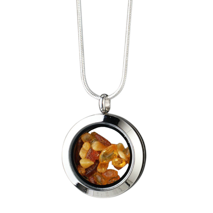 Handmade amber amulet with natural amber encased in glass, set in stainless steel.