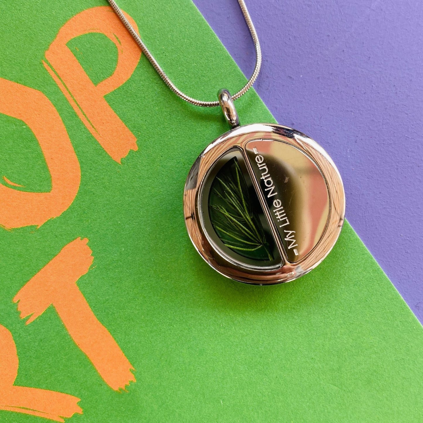 Duality pendant necklace with pine needles