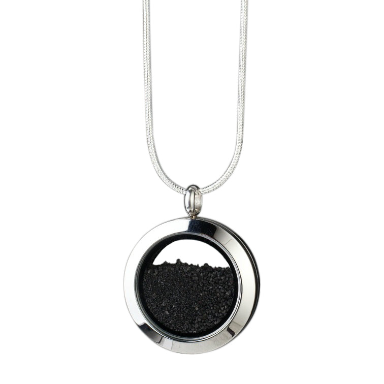 Handmade Volcanic Sand Amulet with genuine volcanic sand encased in glass and set in stainless steel, symbolizing strength, resilience, and the transformative power of nature.