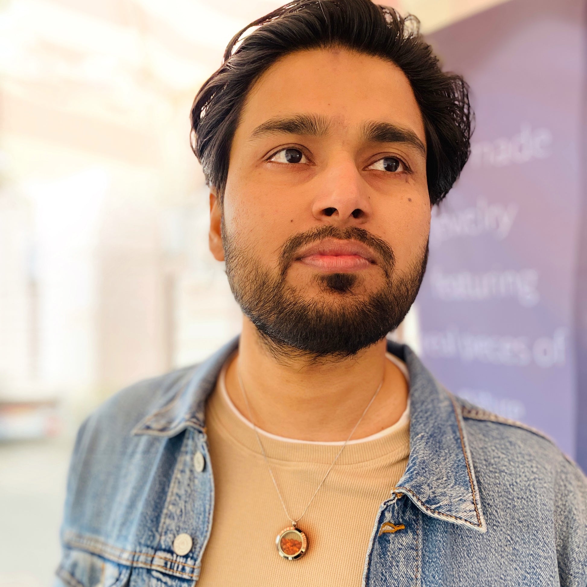 Handmade heather amulet with amber on a male model